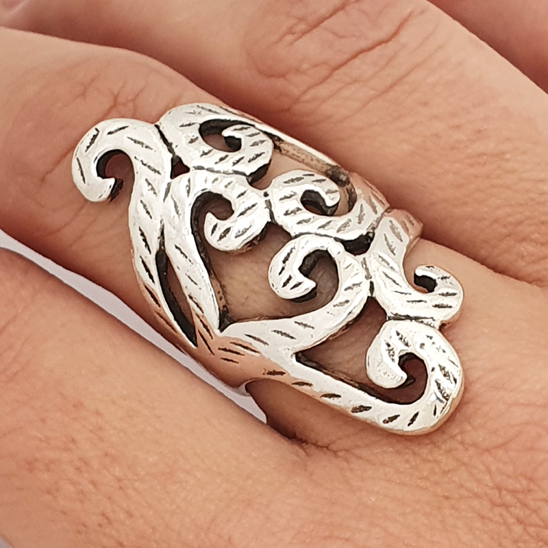 Long arabesque ring