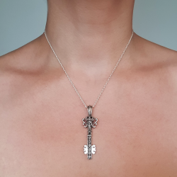 key and skulls silver pendant
