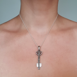 Pendentif argent clé et têtes de mort